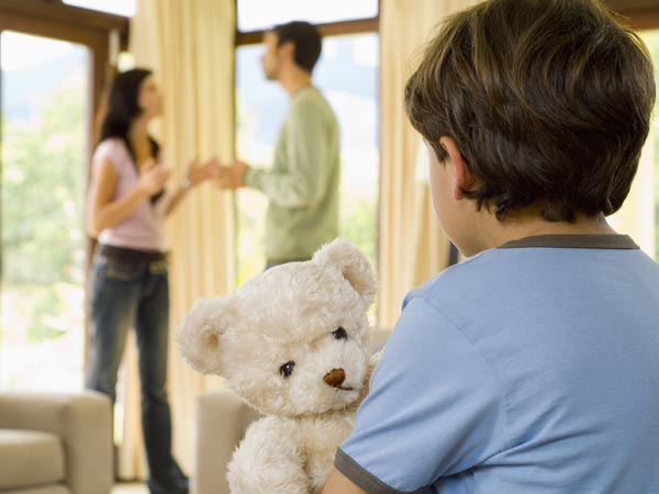 Small boy watching parents fight